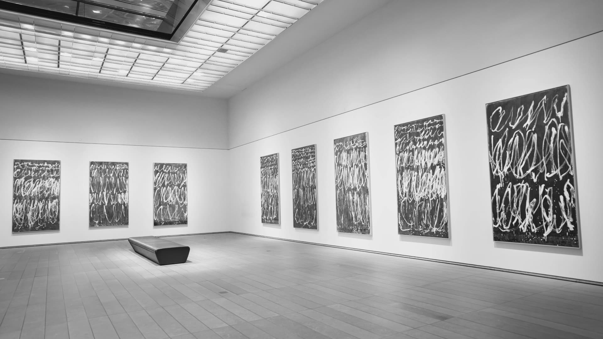 Gallery interior with blue paintings